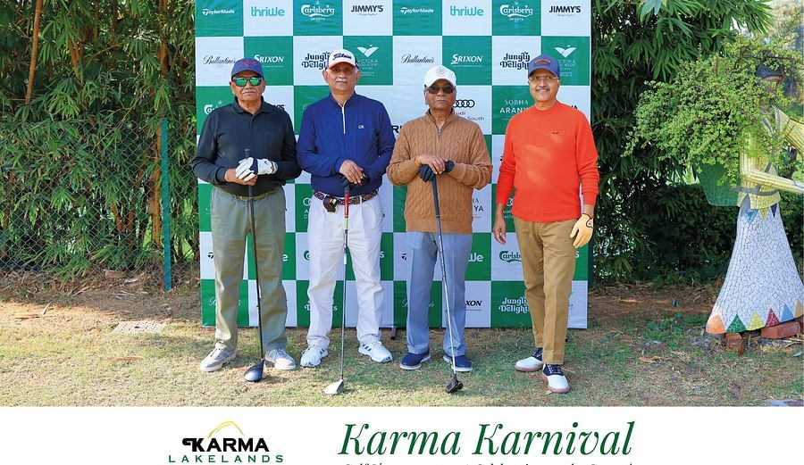 Four participants in casual and sporty outfits, holding awards and posing 