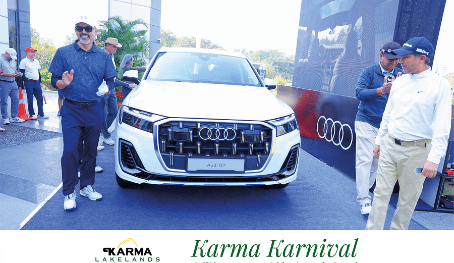 Individuals clisking the pictures with the car in an event