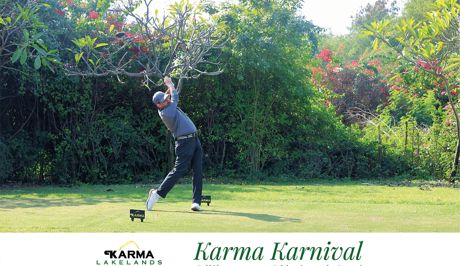 Picture of a person holding the club after the swing.