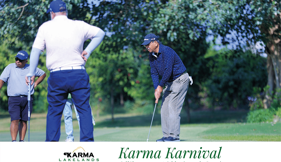 Picture of a two people playing golf at the karma karnival tournament