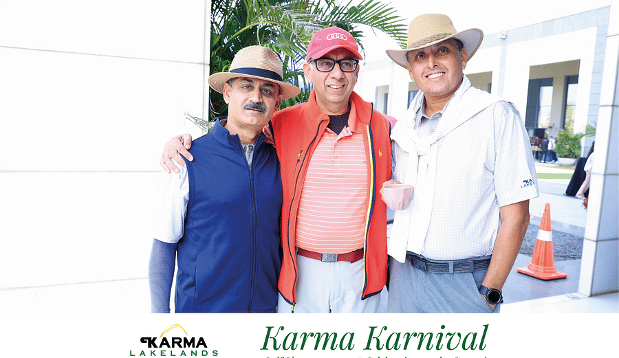 Picture featuring three people posing for the picture in the bright day light