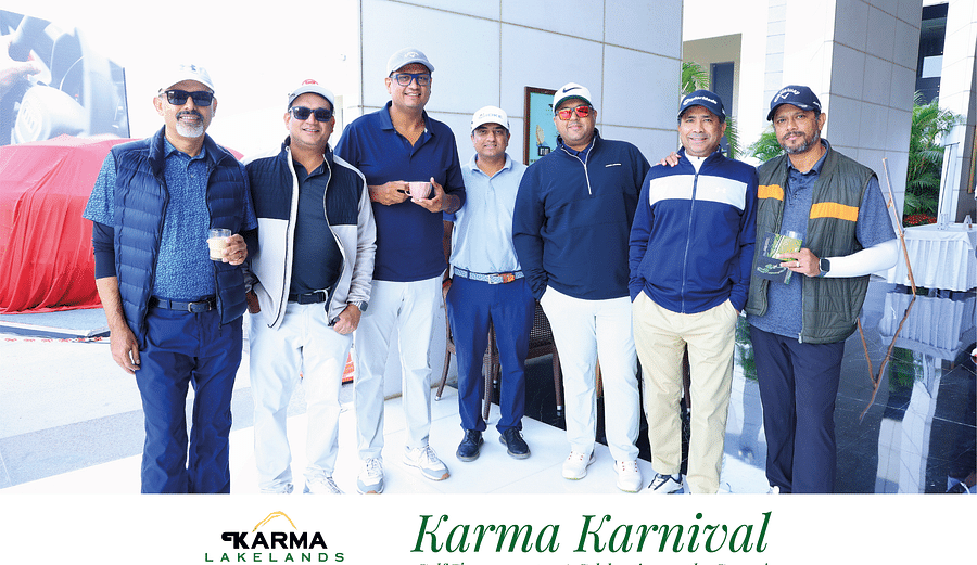 A group posing for the picture at Karma Lakelands-Karma Karnival event