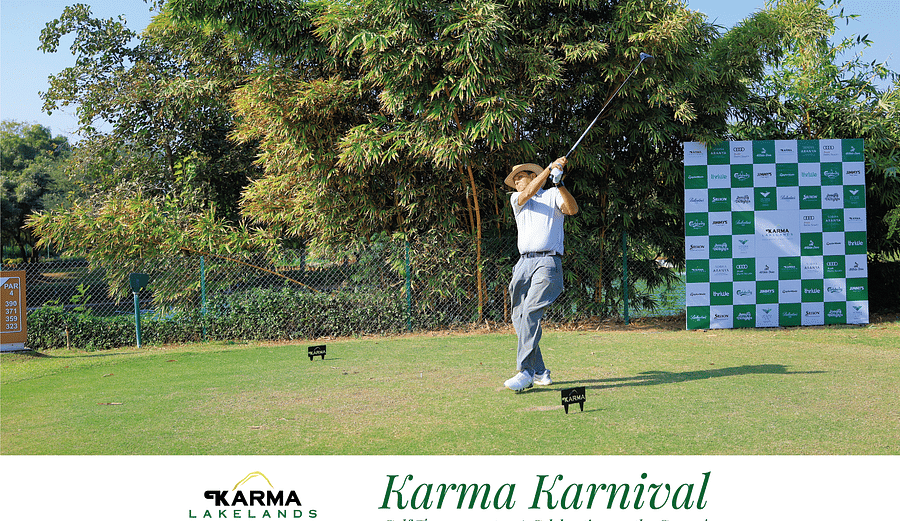 Picture of a person golfing in the day time - karma karnival