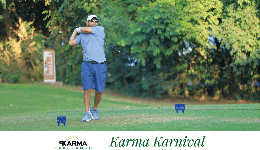 Picture of a person holding the club after the swing.