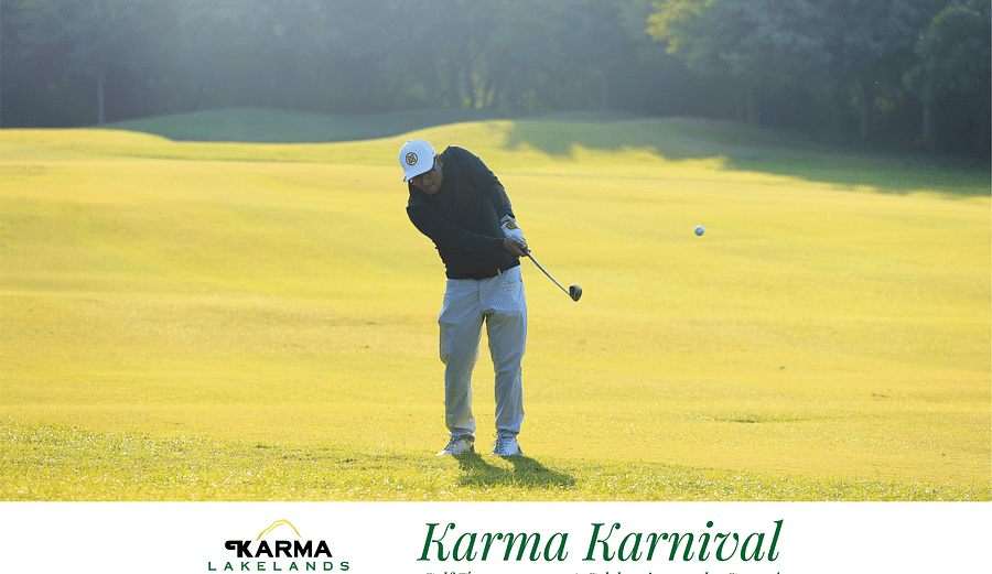 Picture of a man swinging the club in the bright day light.