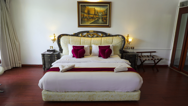 a double bed inside Queen Suite - White pearl suites by rosetum 