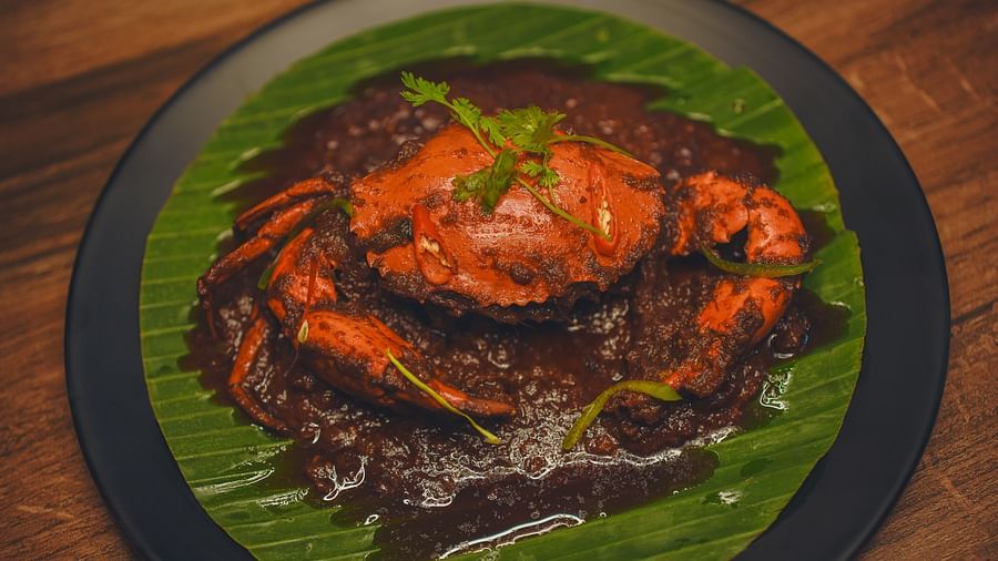 image of dish featuring whole crab smeared with spices - Dip Holidays, Birbhum