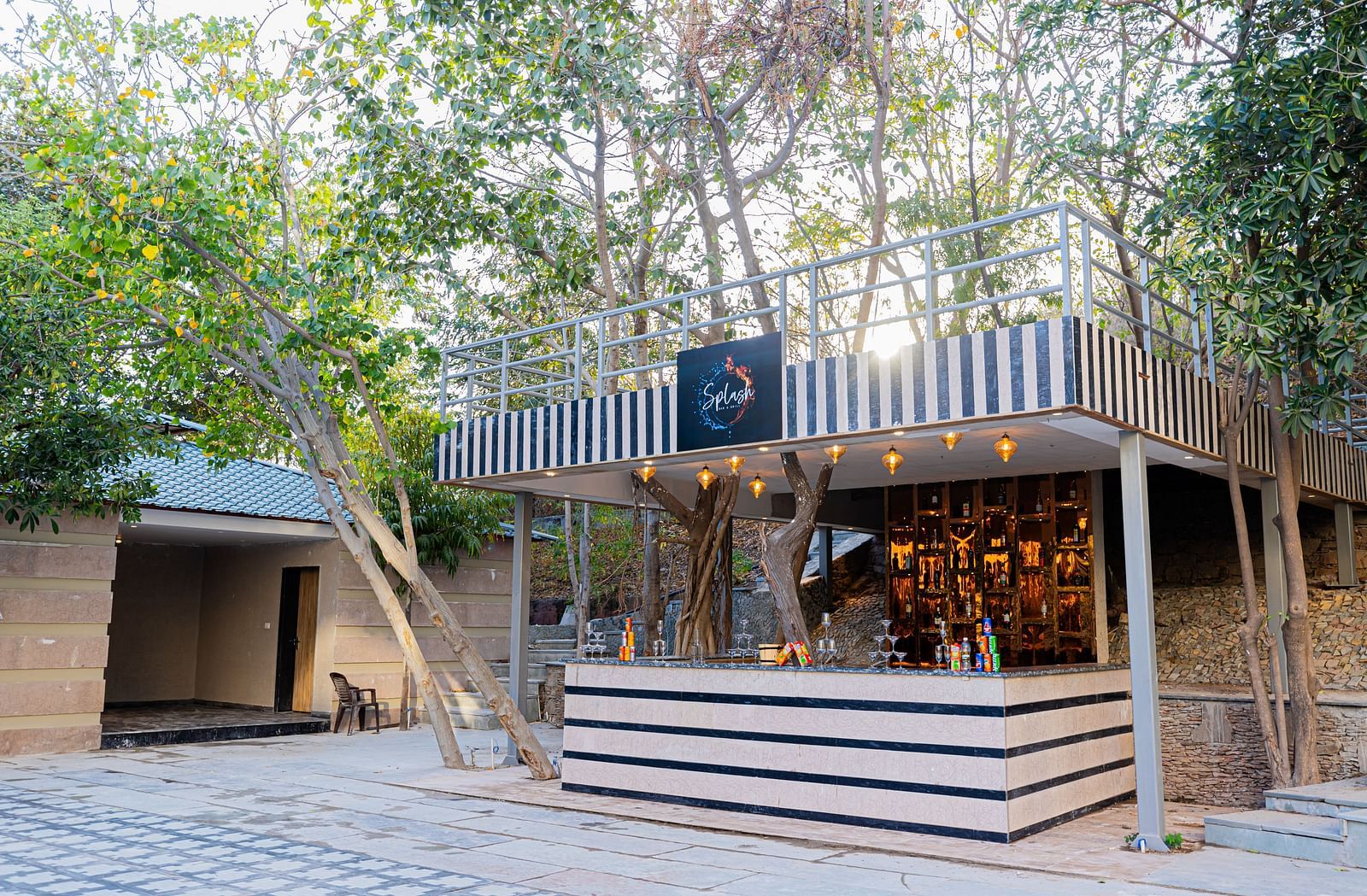 A view of Splash Bar and Grill counter placed outside at Essentia Luxury Resort & Spa, Udaipur.