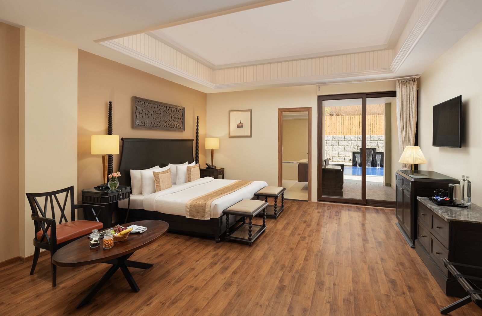 Presidential Suite Room with double beds placed in front of TV at Essentia Luxury Resort & Spa, Udaipur.