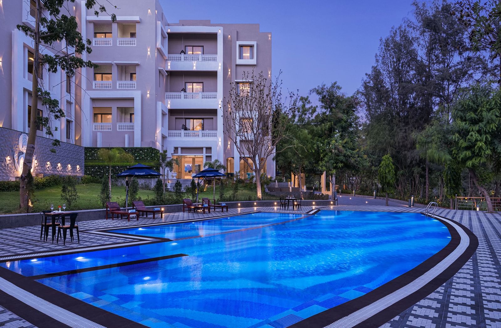 A swimming pool view at evening at Essentia Luxury Resort & Spa, Udaipur.