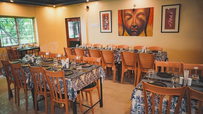 A dining space featuring neatly arranged tables and chairs