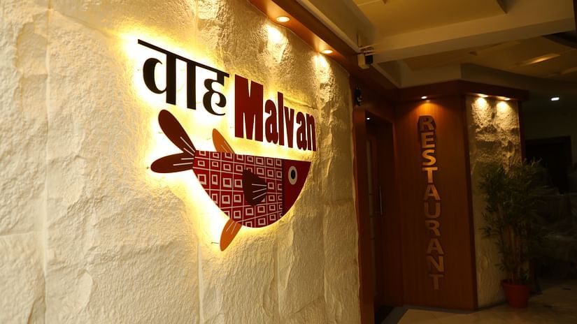Entrance of Wah Malvan Restaurant with illuminated sign and decor at VITS Select Grand Inn, Ratnagiri