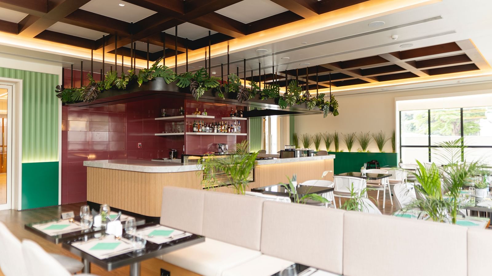Meli-Melo Restaurant at KertelSuites, featuring elegant seating arrangements and stylish ceiling lights