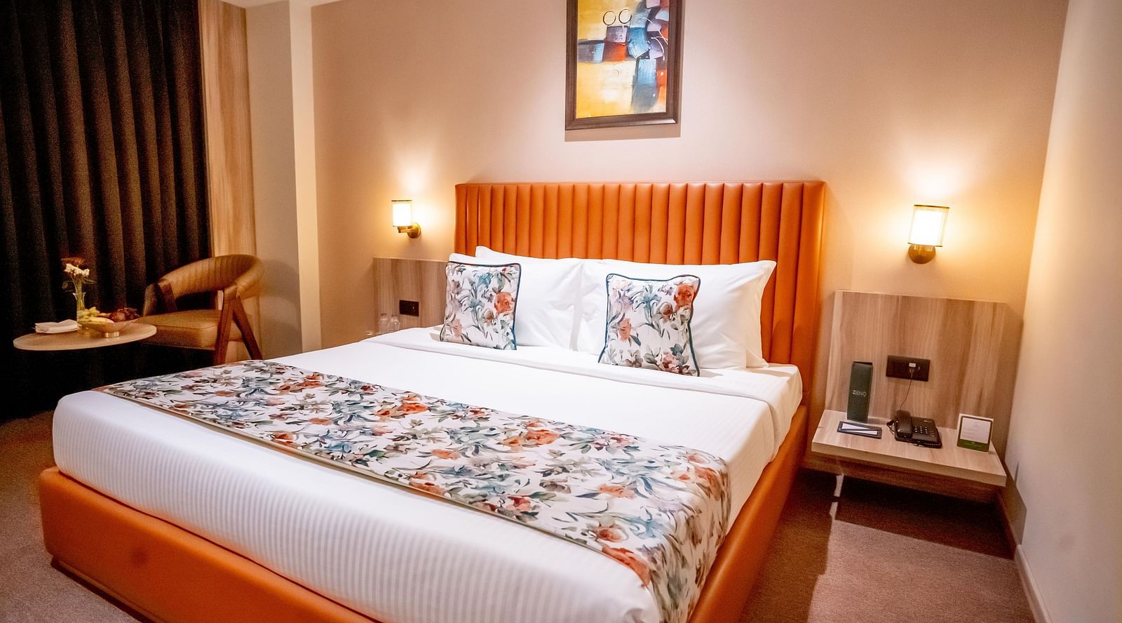 Superior Room at ASTER GRAND BY ZENQ SAKET with a bed, bed side table, a chair and a window with curtain in the background.