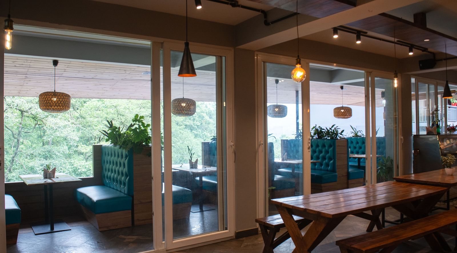 Image of Mad Monkey with dining tables and chairs at  Avianna Ganagtok Resort and Spa