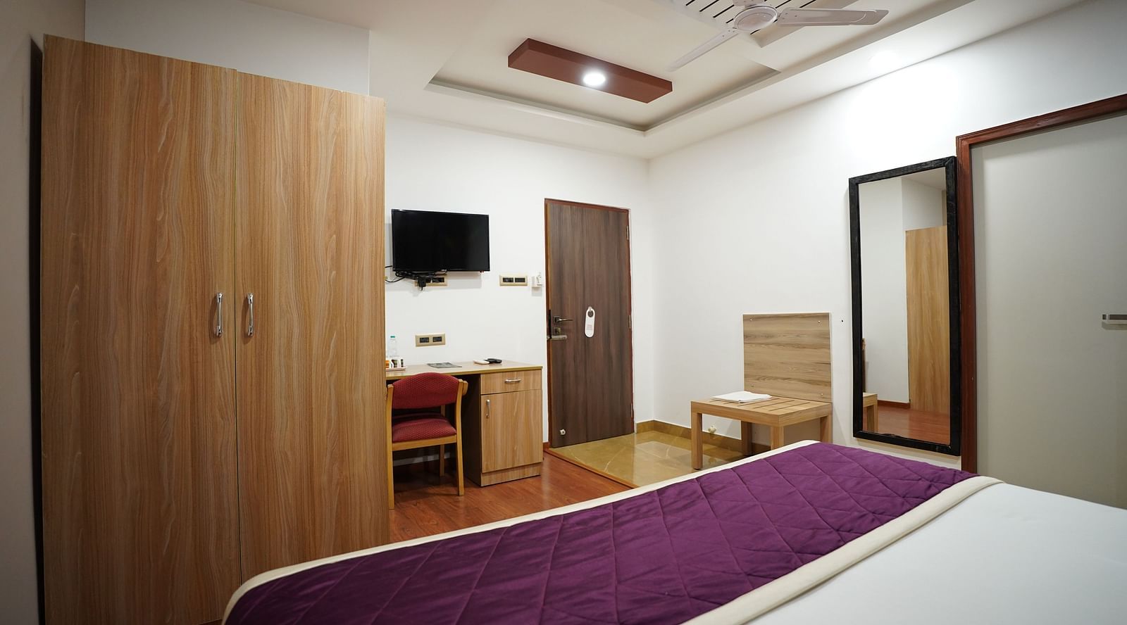 an image of a side view of the deluxe room with a television