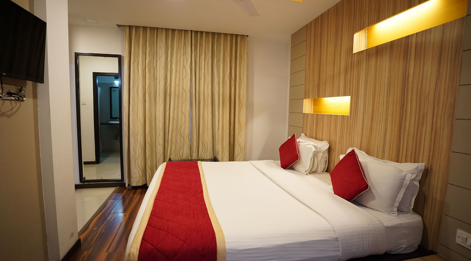 an image of a side view of the bedroom with a television at  City Centre Residency, Bangalore