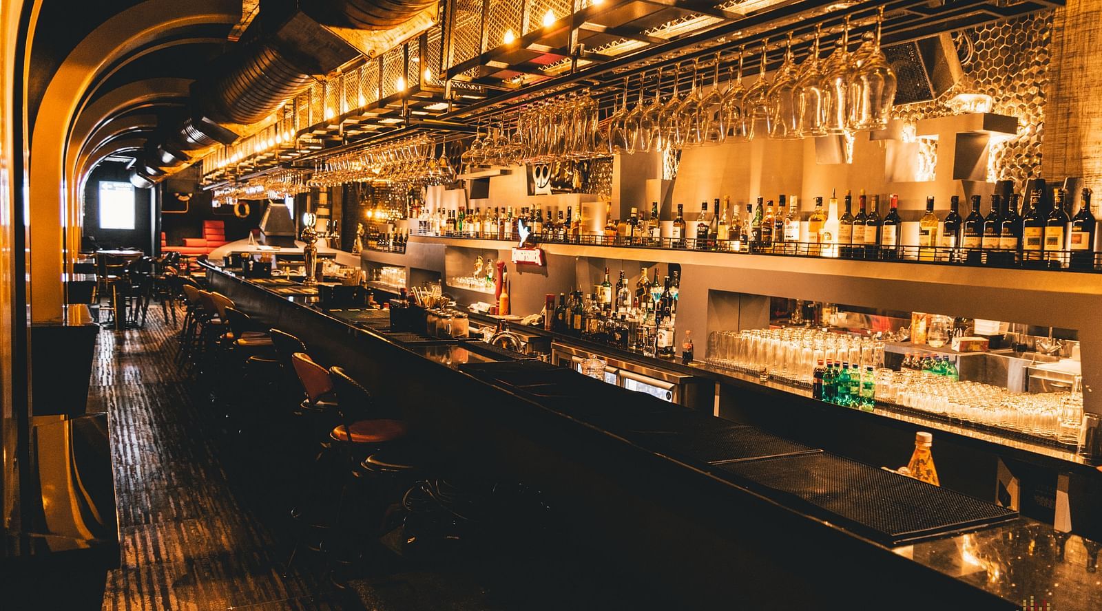 image of a bar counter with varieties of alcohol placed on display - Hotel Park Elanza, Chennai
