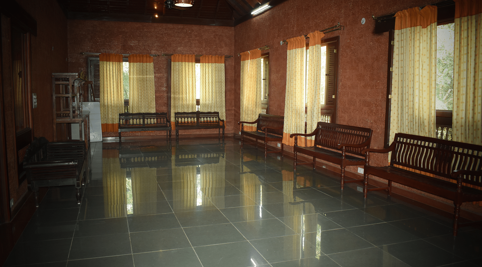 interior of the malnad palace lounge and hall at hoysala village resort in hassan
