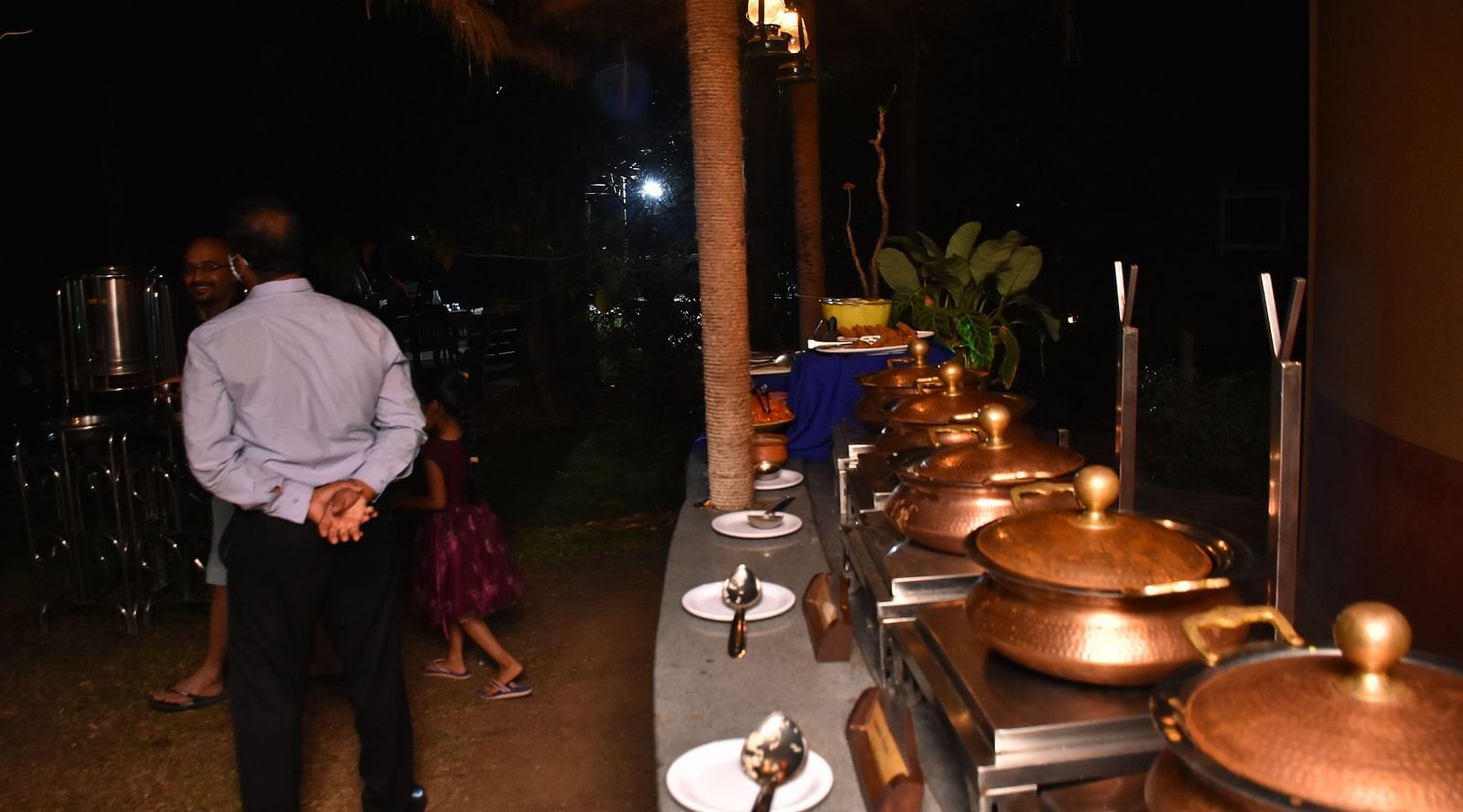 image of a well spread beffet for the guests dining at the garden restaurant in hoysala village resort, hassan