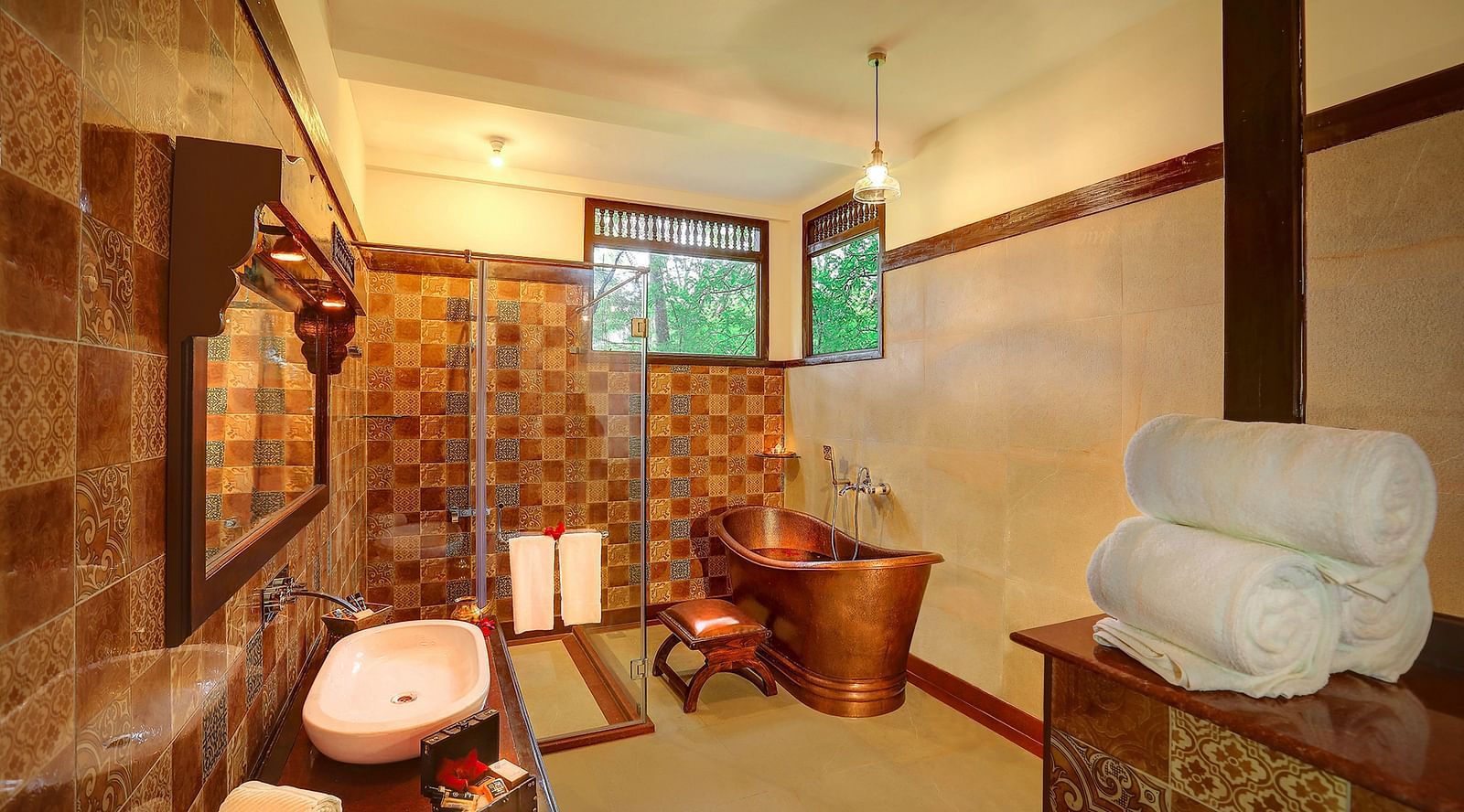 An image of a bathroom with various toiletries and amenities - Hoysala Village Resort, Hassan
