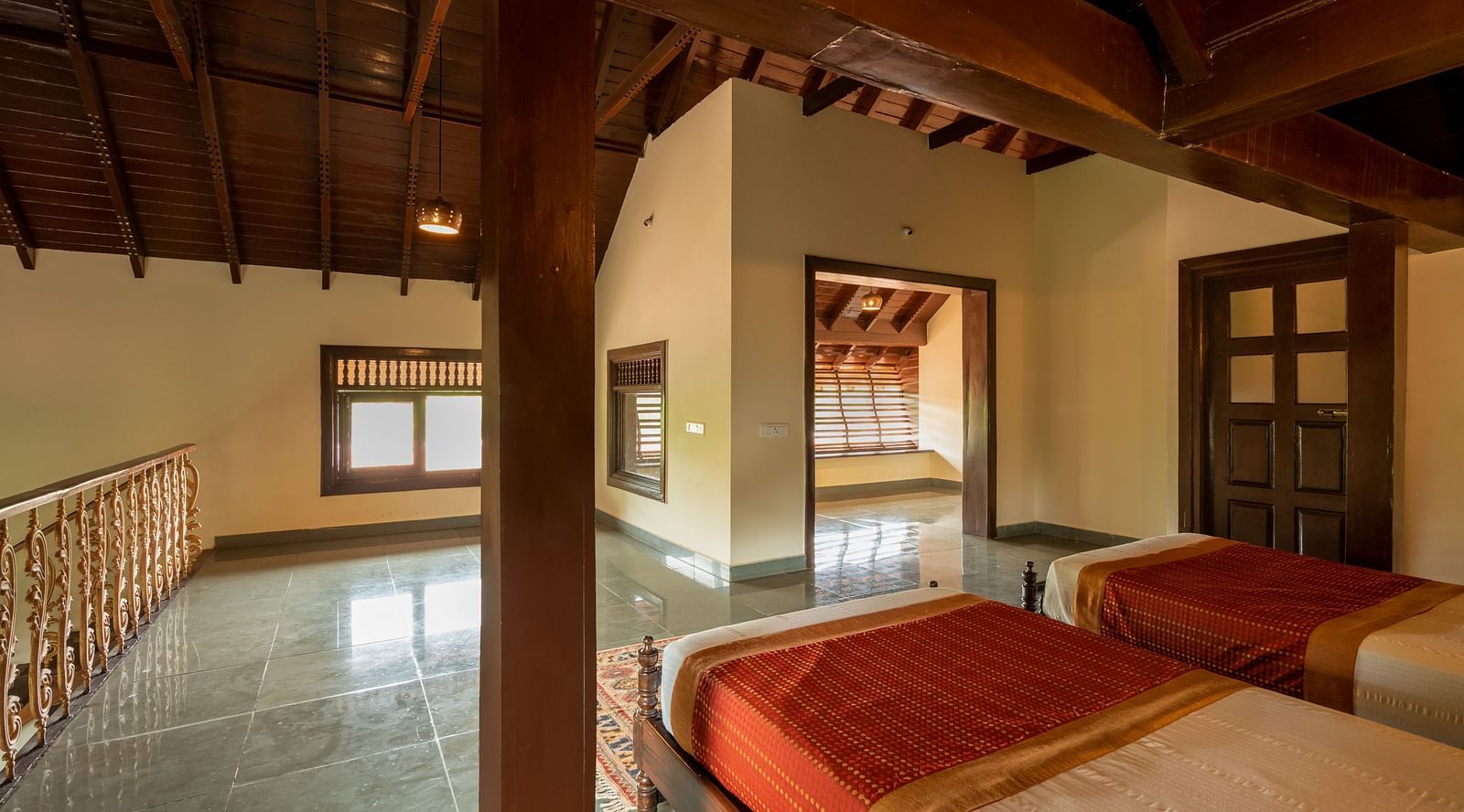 An image of a twin bed bedroom, an open door, and windows - Hoysala Village Resort, Hassan