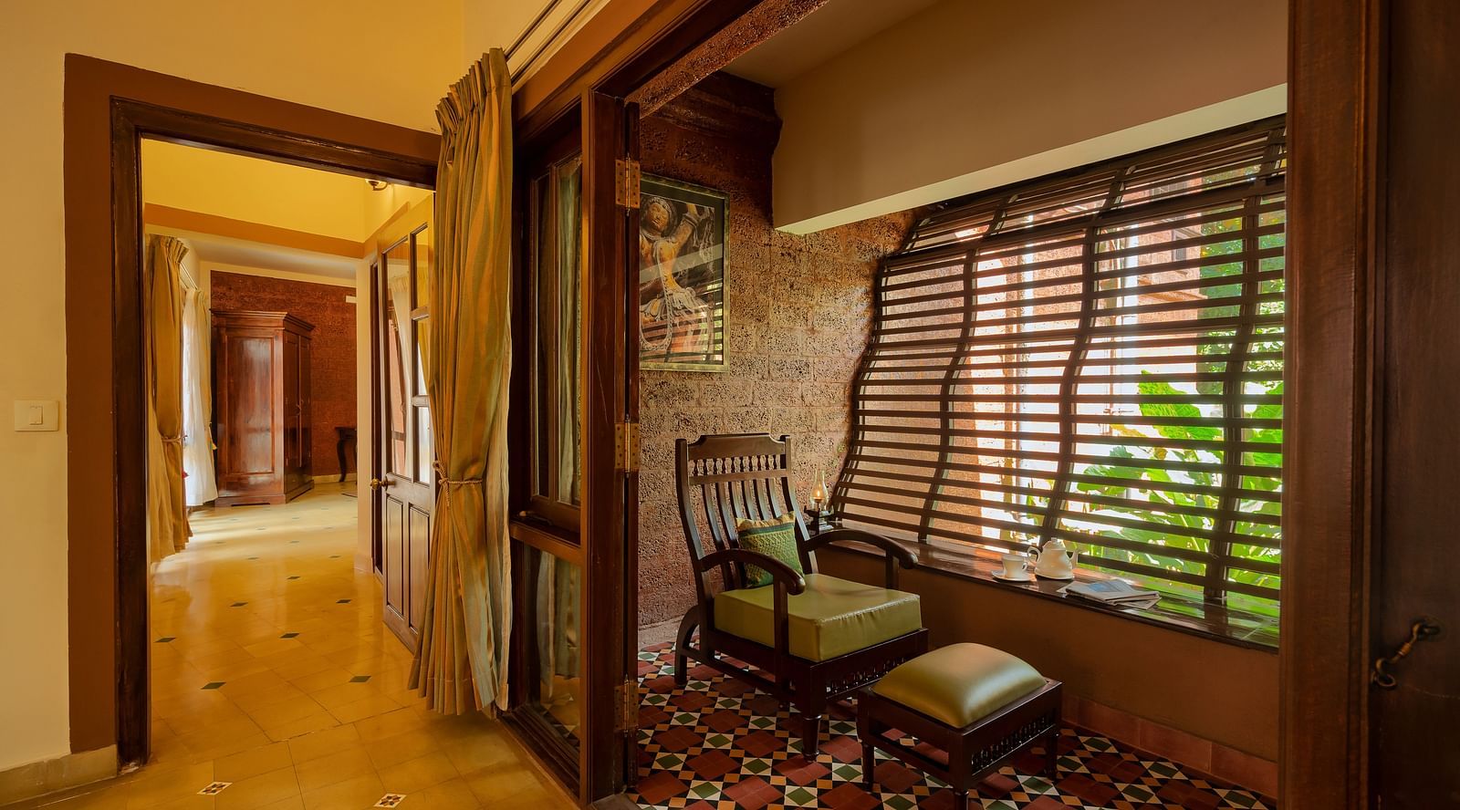 corner view of the sit out area besides the corridor at the luxury Jacuzzi villa at hoysala village resort, hassan