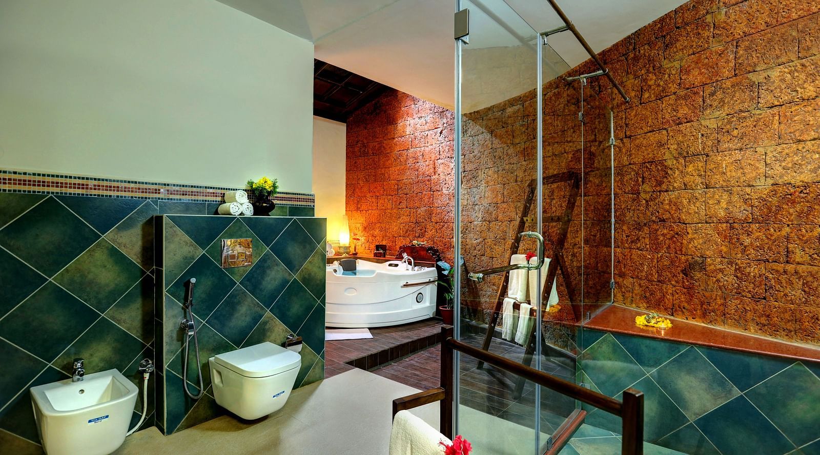 An image of a western style bathroom with showerheads, glass, fauctes, buckets, and other functionalities - Hoysala Village Resort, Hassan