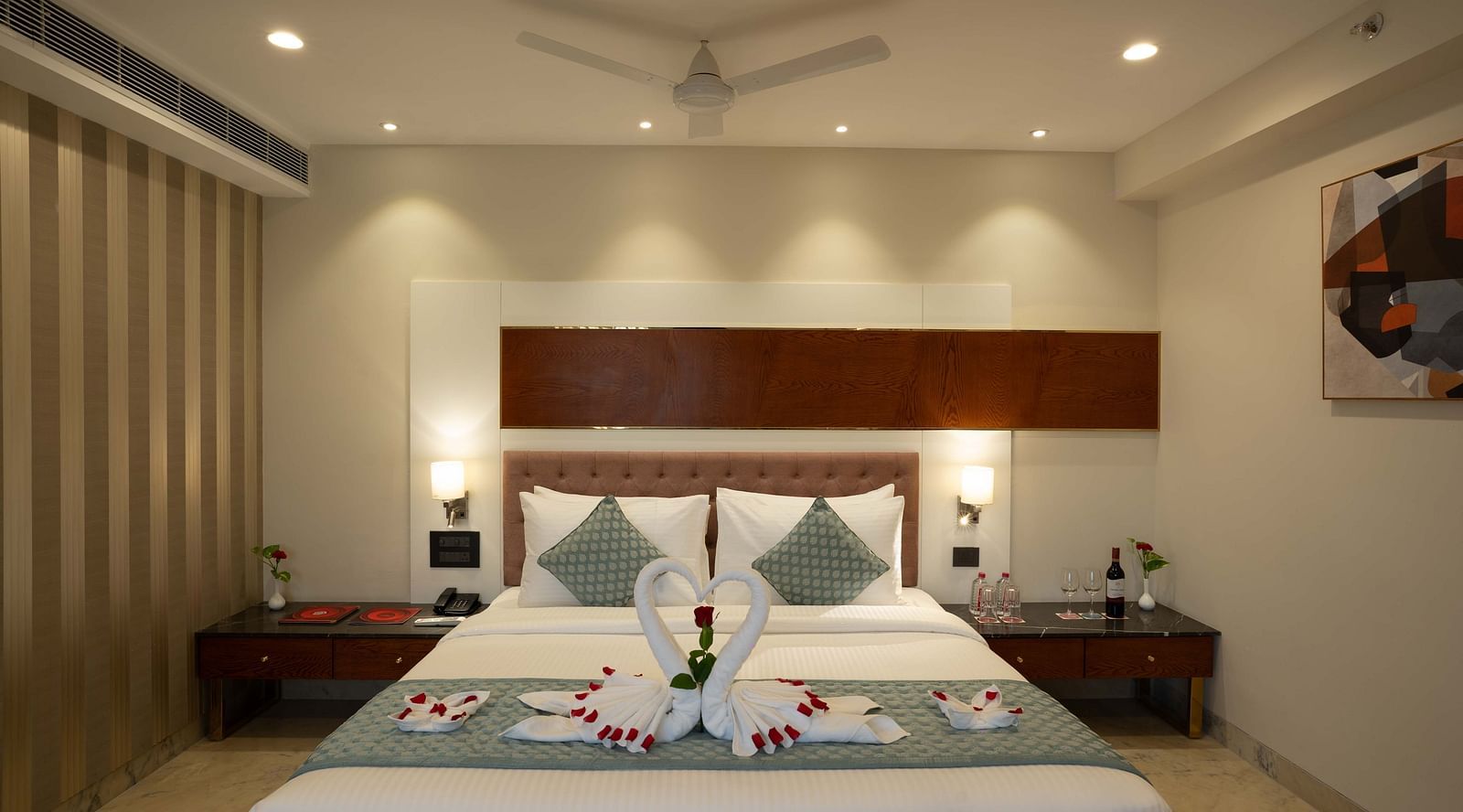 Club Room with a large double bed with decorative amenities artistically arranged at Inde Signature Jaipur