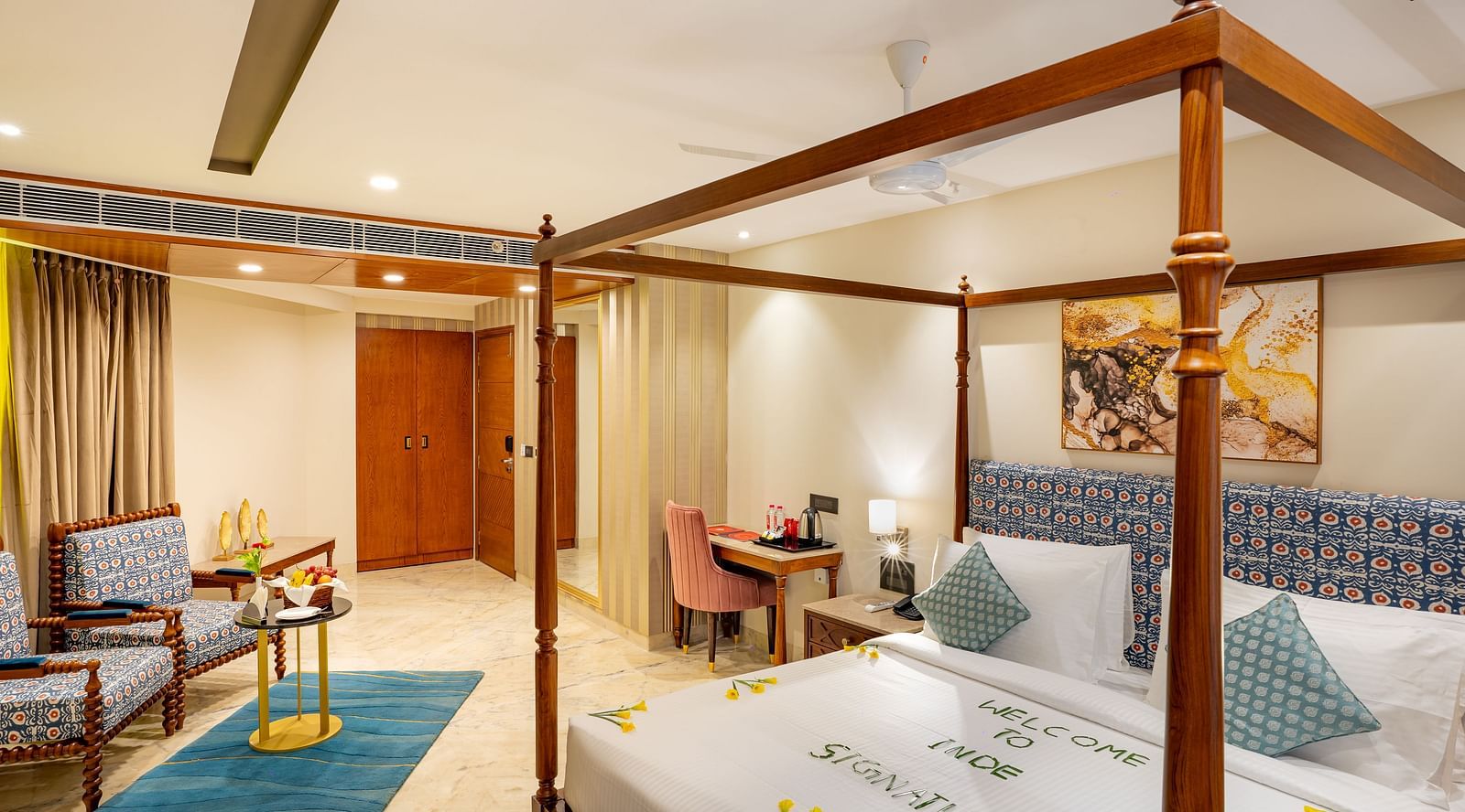 Spacious Suite with double bed, comfortable seating at Inde Signature Jaipur