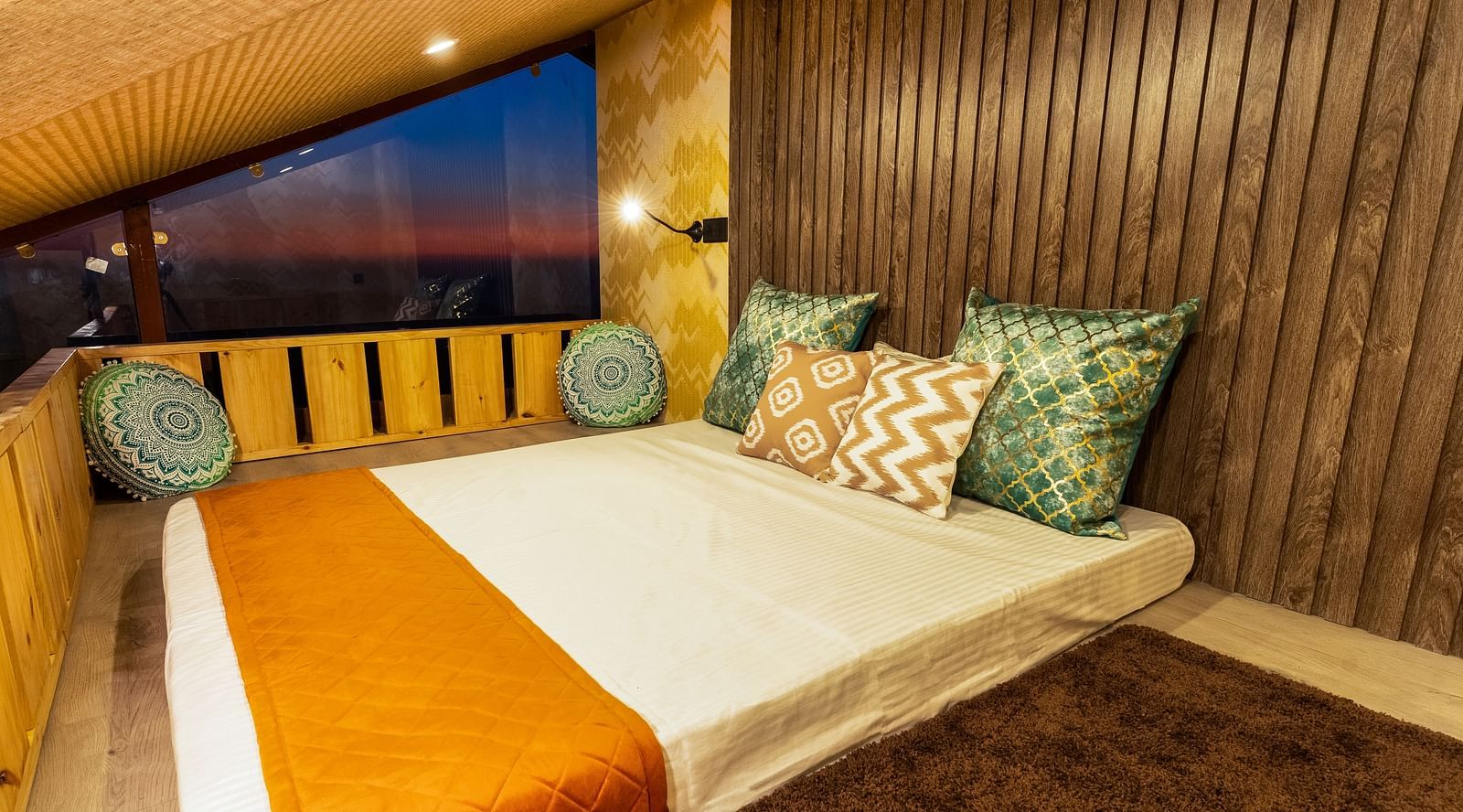 A double bed in the attic area of a room at Infinitea Retreat Bir
