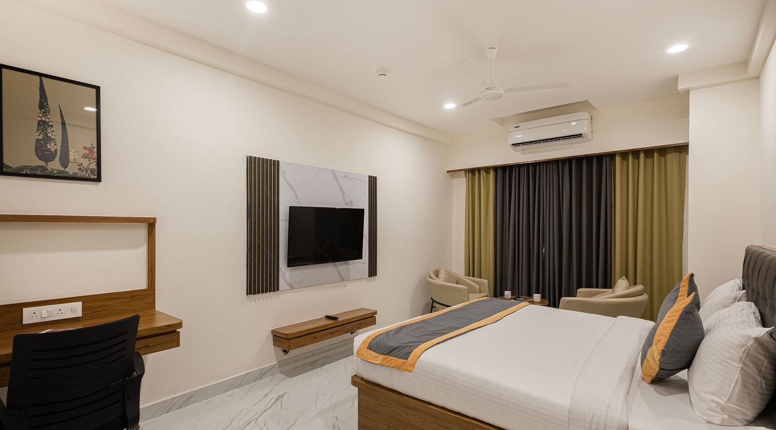 Spacious  Comfort King Room with work desk and TV at Lemonridge Hotels, IDPL Balanagar