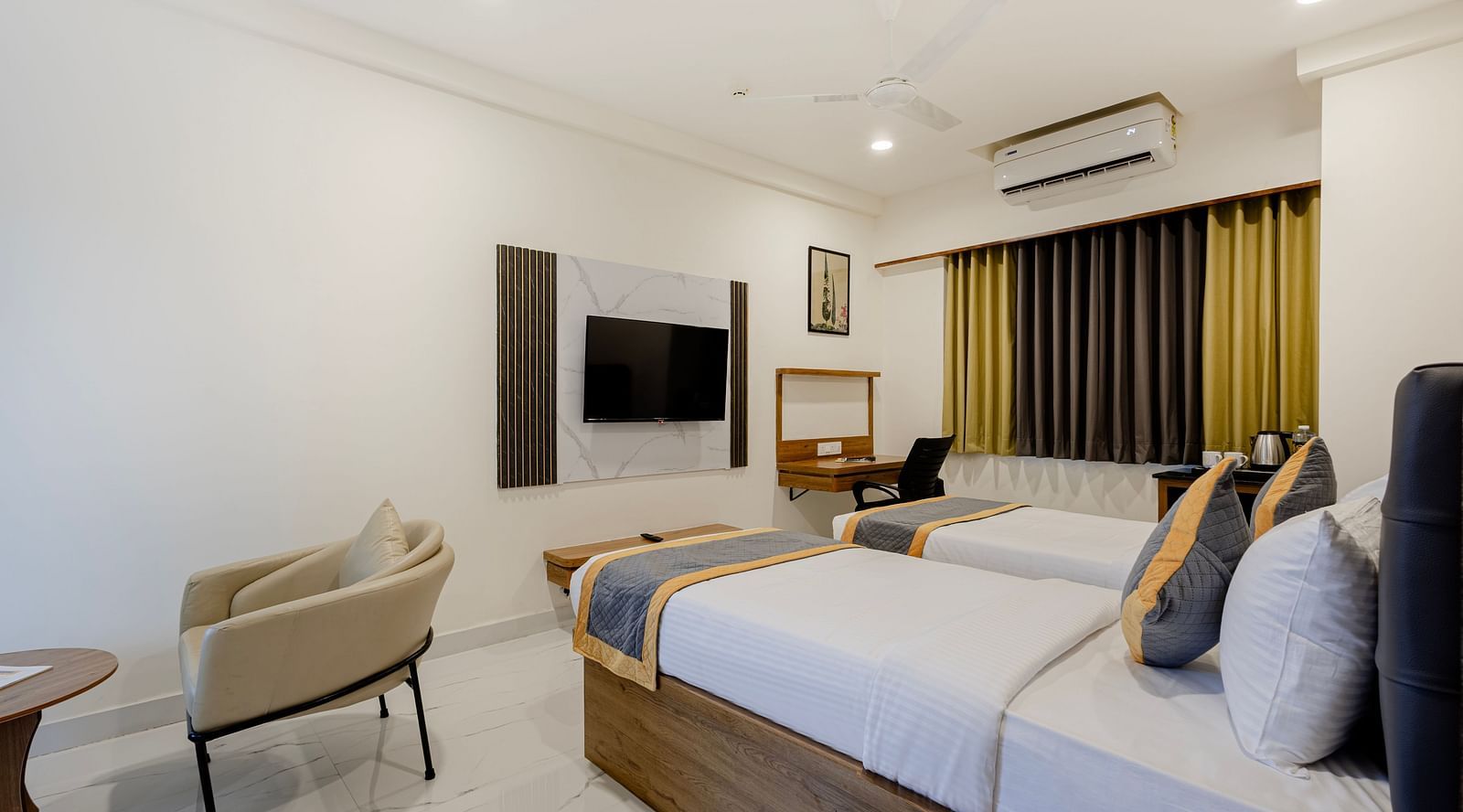 Twin-bed room with clean design and modern amenities at Lemonridge Hotels, IDPL Balanagar.