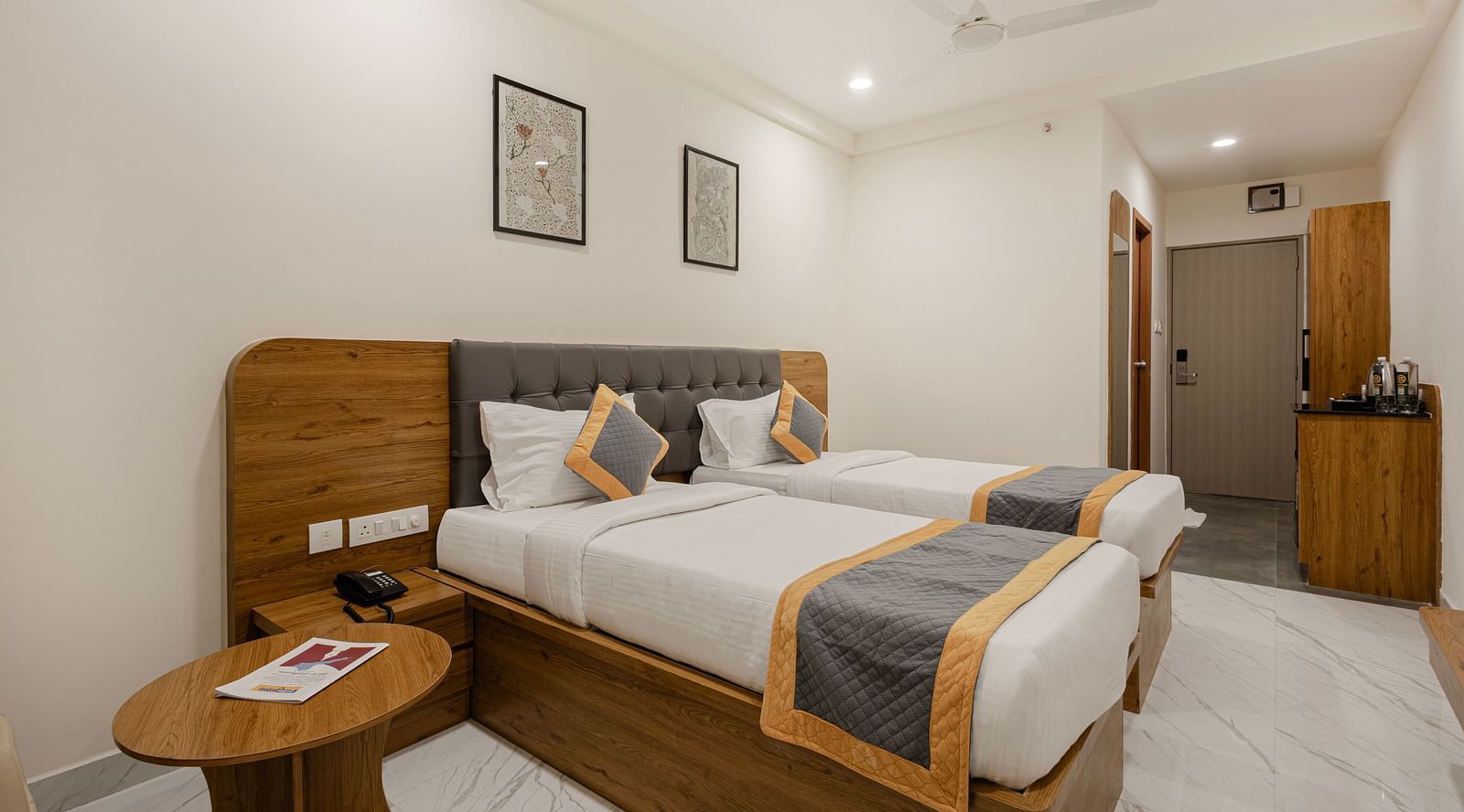 Corner angle of the twin bedroom with light and contemporary design at Lemonridge Hotels, IDPL Balanagar