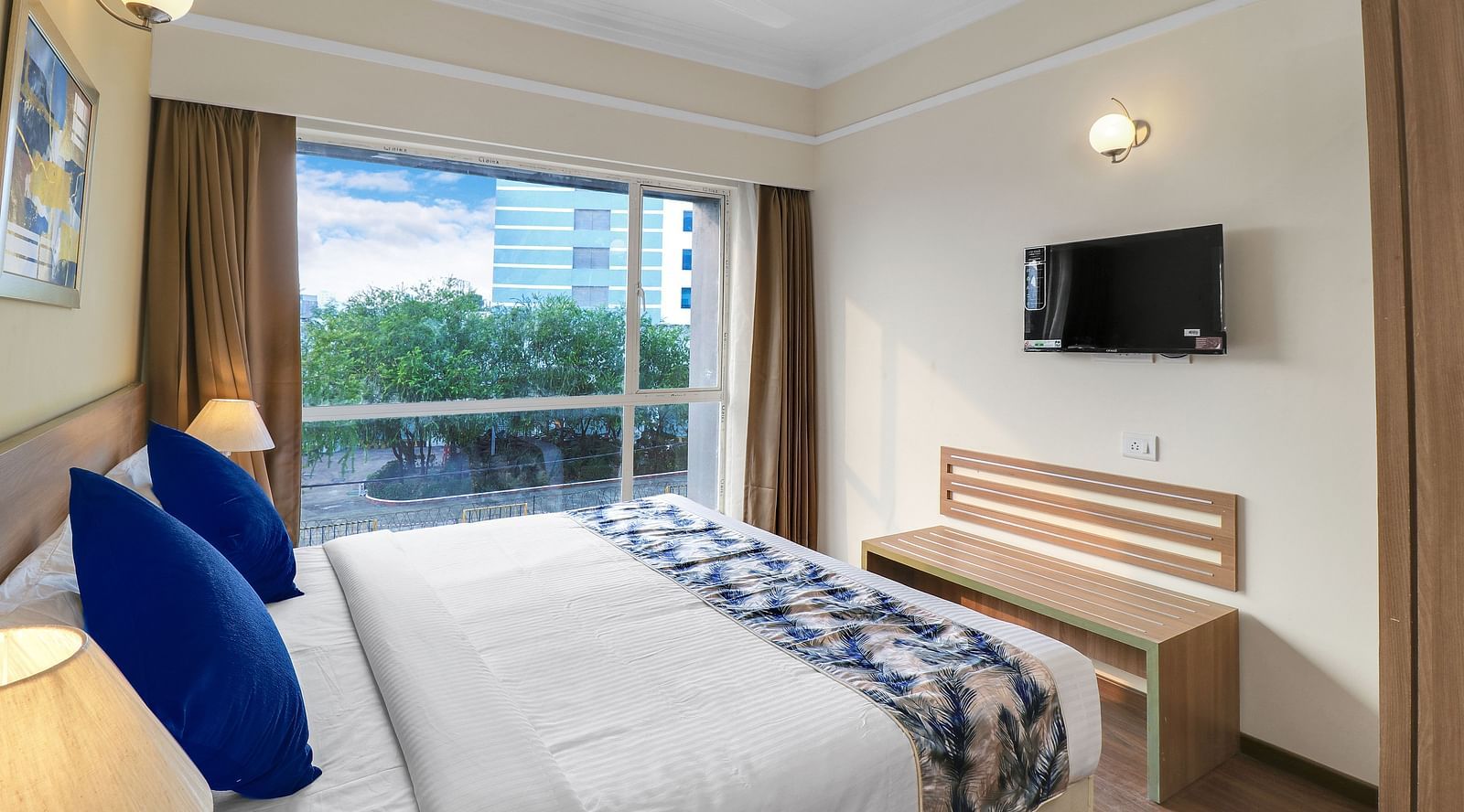 a double bed inside Deluxe One Bedroom Suite 3 - Starlit Suites Newtown, Kolkata