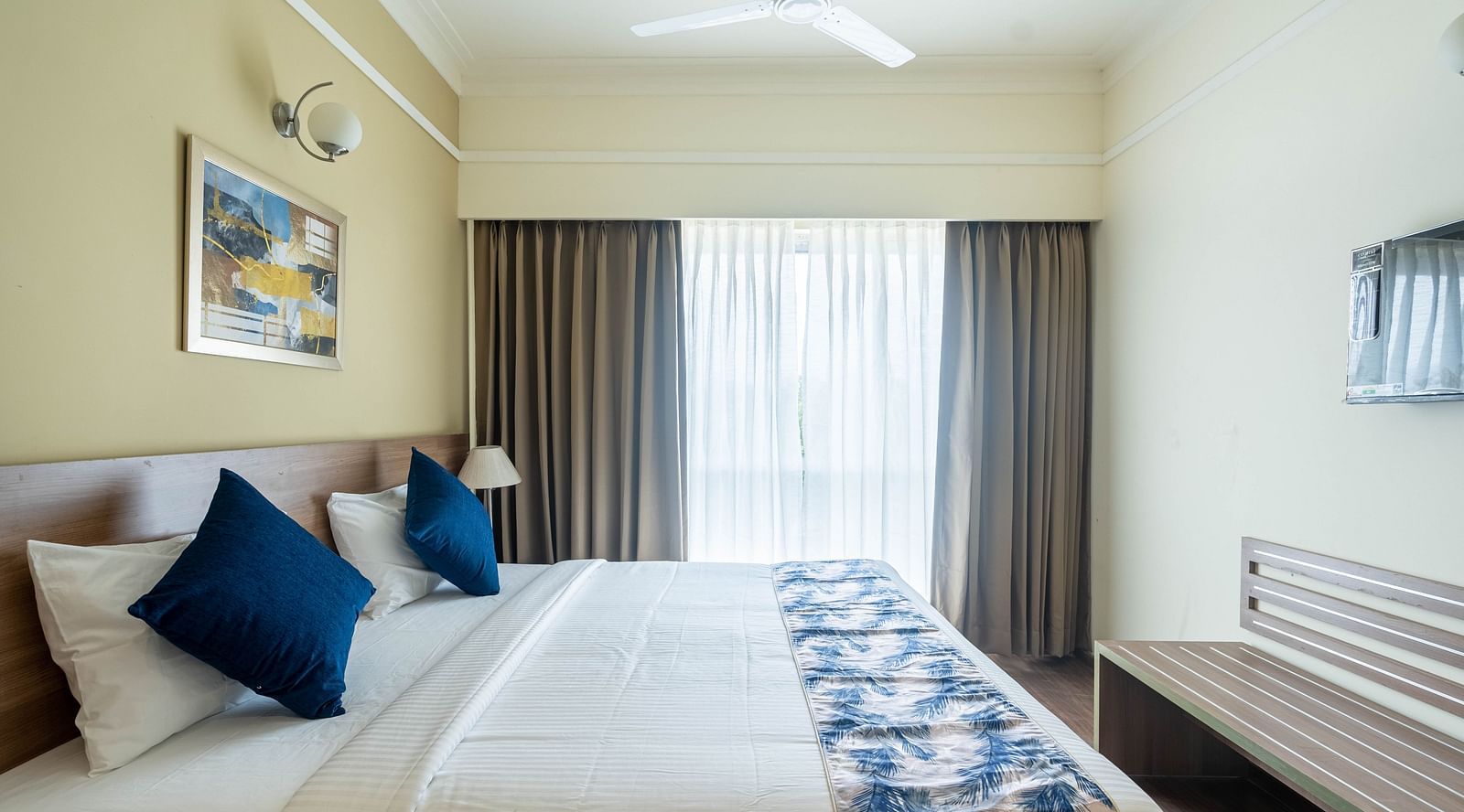 a double bed inside Premium Studio - Starlit Suites Newtown, Kolkata