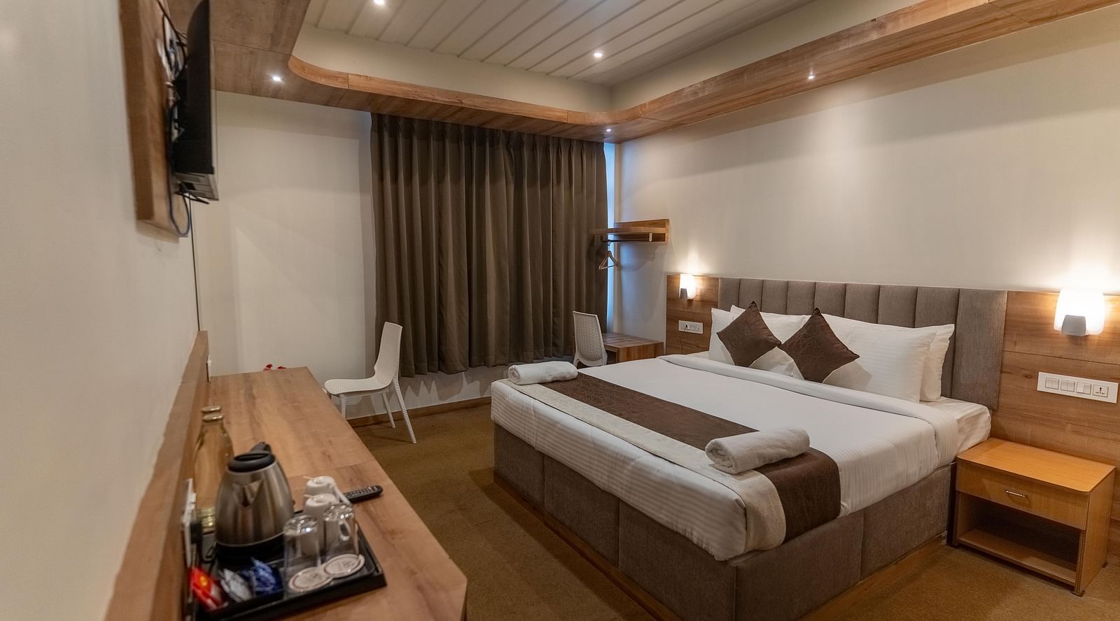 standard room with plush bedding at the soma hotel by avianna group, darjeeling