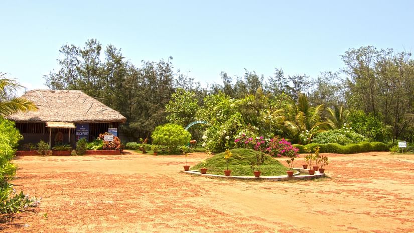 A wide and long view of reception with garden view -Lotus Eco Beach Resort 