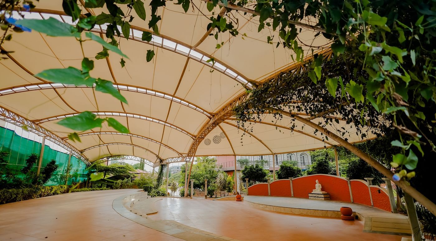 A view of the outdoor event space with the canopy and stage at Nirantara Resort & Spa.