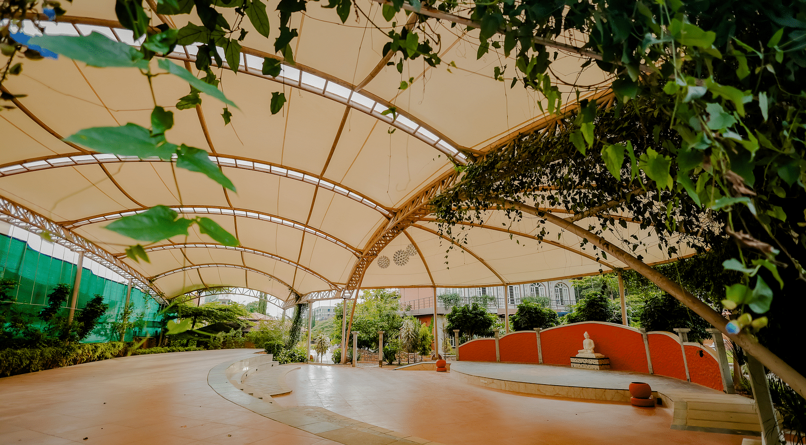 A view of the outdoor event space with the canopy and stage at Nirantara Resort & Spa.