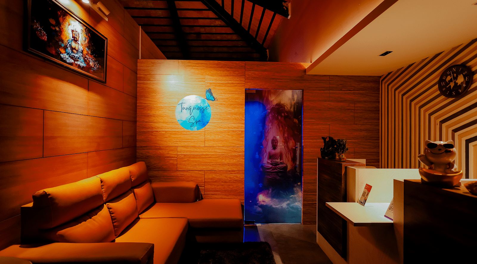 A dimly lit lounge or relaxation area at Nirantara Resort & Spa with comfortable seating and warm lighting.