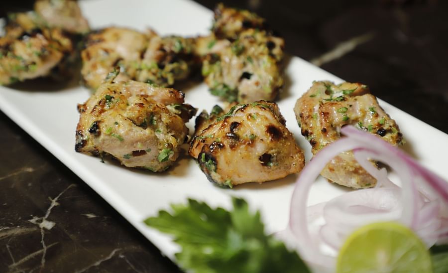 Udman By Ferns N Petals, Chattarpur - chicken malai tikka kebab at a restaurant table