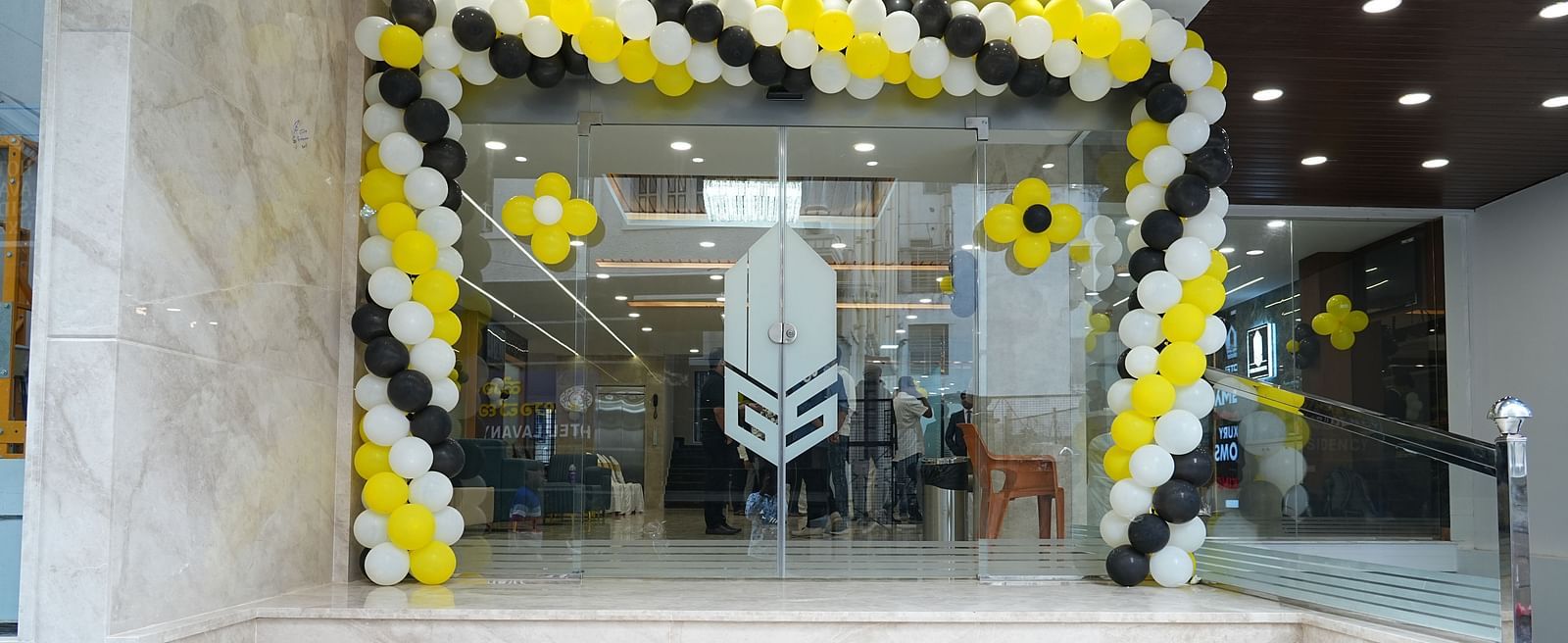 a staircase leading to the entrance of our hotel in Bangalore decorated with balloons - Hotel Grand Sigma
