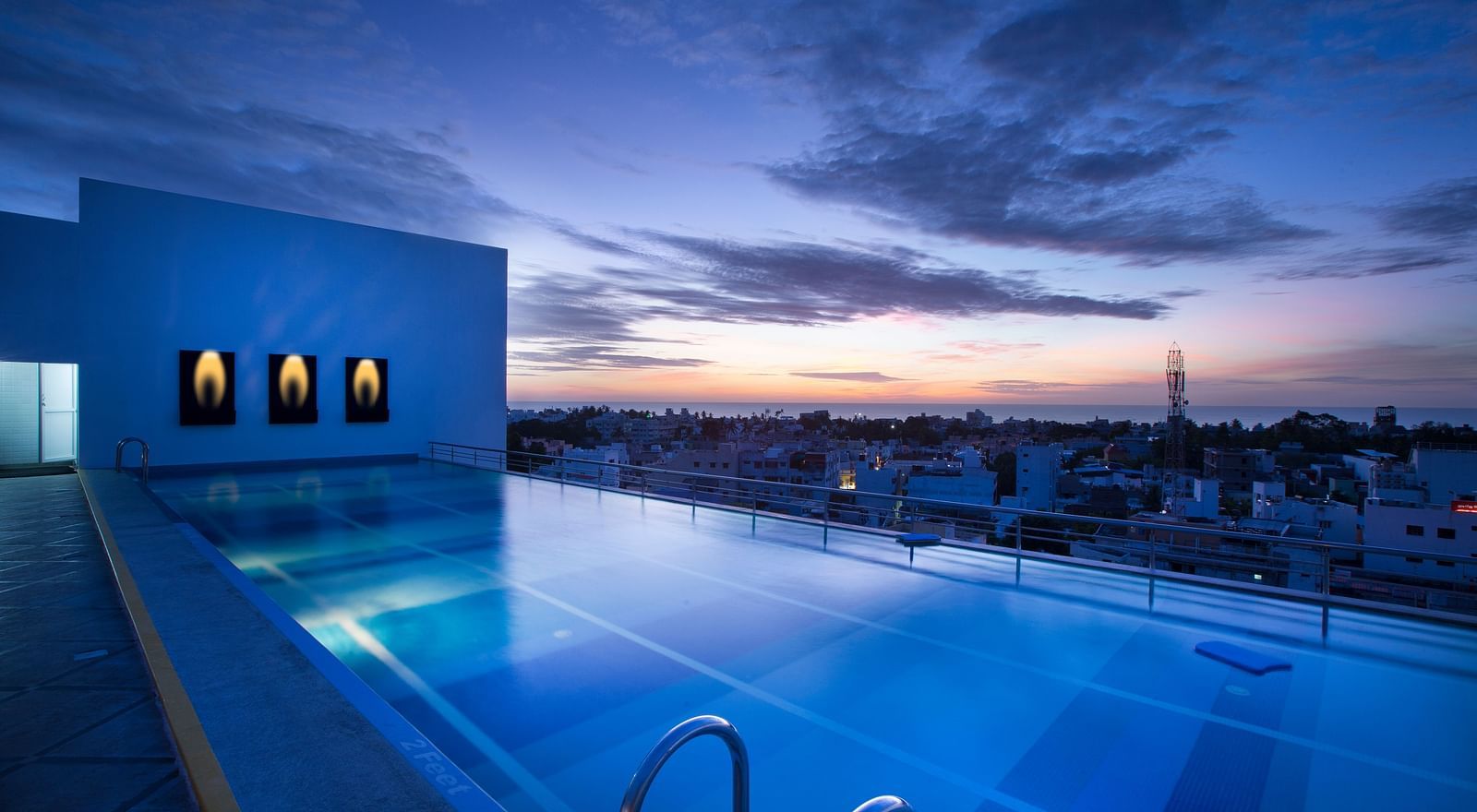 Atithi rooftop pool at sunset