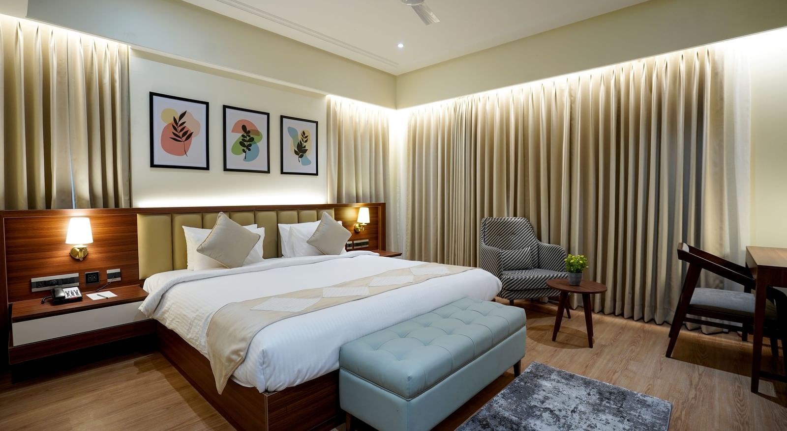Full view of the Superior King Bed Room featuring a king size bed along with a cushioned bench in placed in front of it at M2 Square by Monday Premium.