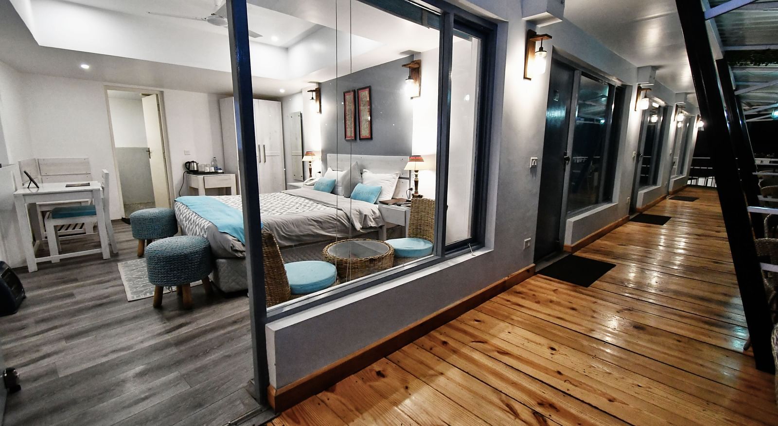 image of the balcony adjoining with the premium room with wooden flooring - The Tattva Boutique Resort