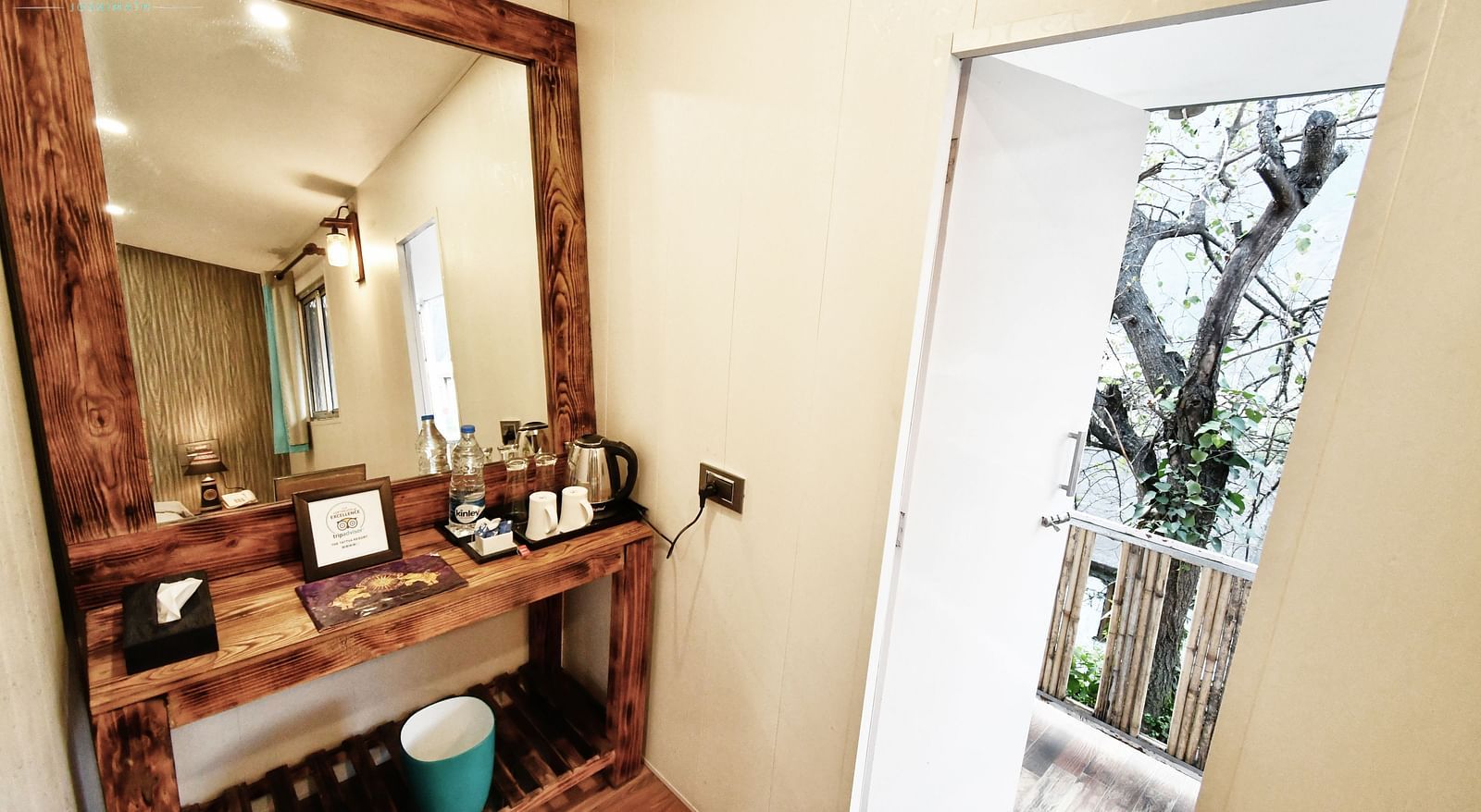 close up image of the dressing table with a square shaped mirror in the deluxe room - The Tattva Boutique Resort