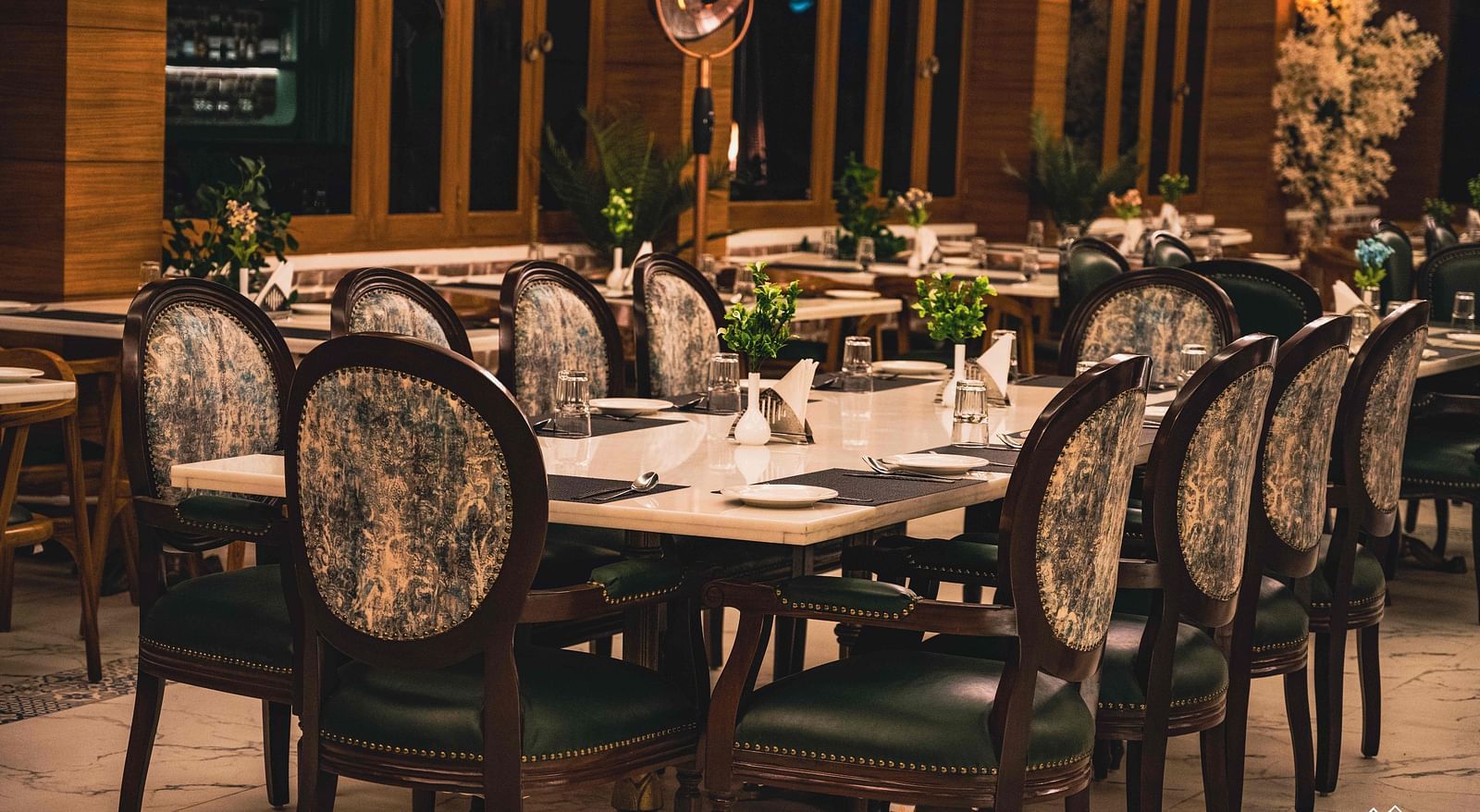 image of the alpenrose restaurant featuring an elegant dining table with well placed cutlery - the tattva boutique resort