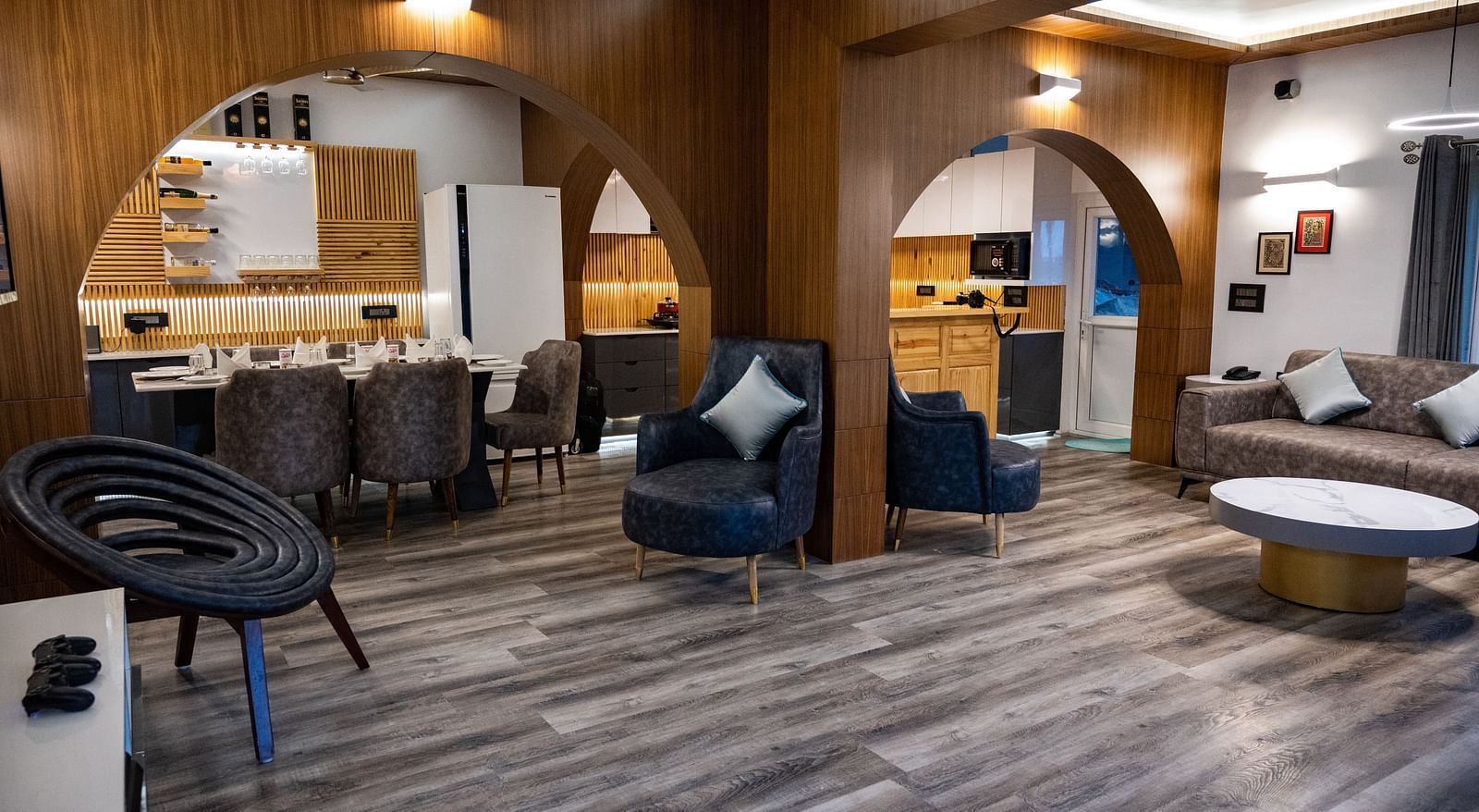 image of the living area with arched doorways in the pent house - The Tattva Boutique Resort
