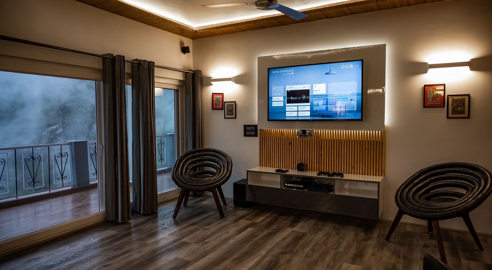 image of the living room of the pent house featuring a huge wall mounted television - The Tattva Boutique Resort